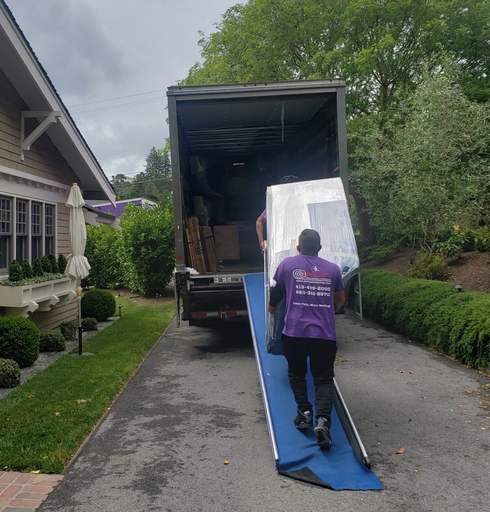 Joshua's Moving team loading a truck