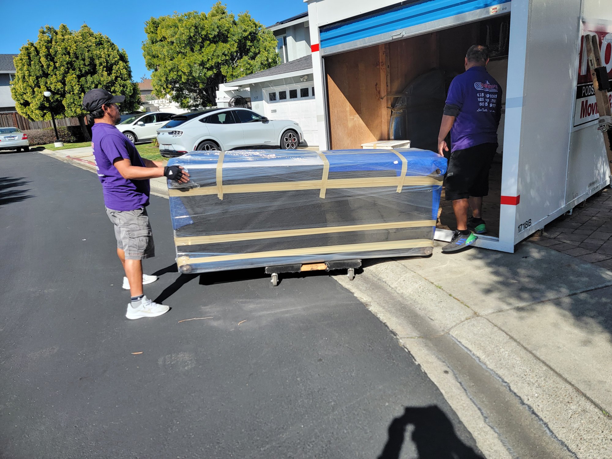 Team loading items into a PODS container